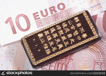 Good luck Chinese hand carved bamboo on a ten euro banknote