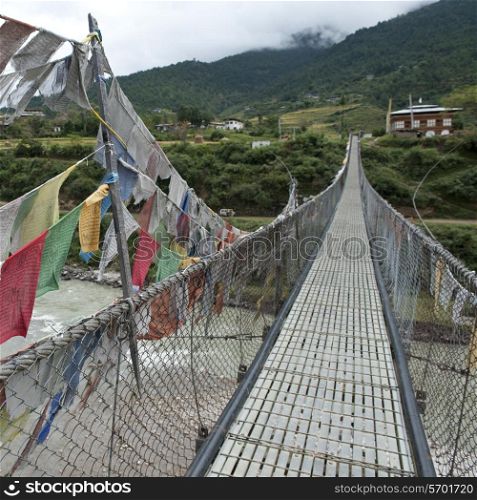 Good luck prayer flags at a suspension bridge in Punakha District, Puntshang Chhu River