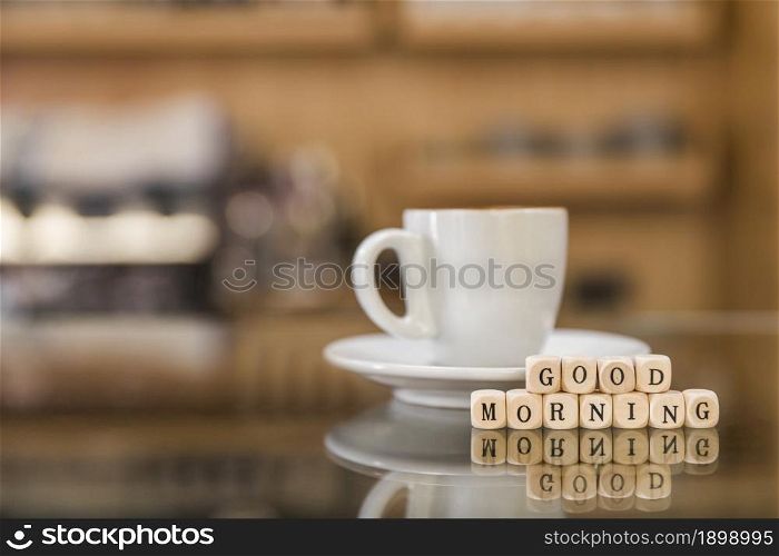 good morning wooden blocks with cup coffee glass counter. Resolution and high quality beautiful photo. good morning wooden blocks with cup coffee glass counter. High quality beautiful photo concept