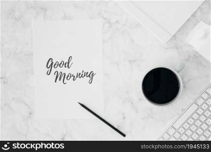good morning written white paper with pencil coffee cup diary milk carton keyboard textured desk. High resolution photo. good morning written white paper with pencil coffee cup diary milk carton keyboard textured desk. High quality photo