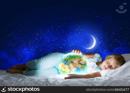 Good night. Girl in bed with Earth planet in hands. Elements of this image are furnished by NASA