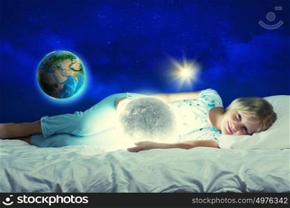 Good night. Girl lying in bed with moon in hands. Elements of this image are furnished by NASA