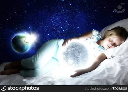 Good night. Girl lying in bed with moon in hands. Elements of this image are furnished by NASA