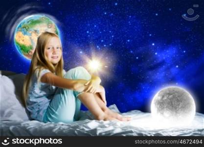 Good night. Girl sitting in bed and dreaming. Elements of this image are furnished by NASA