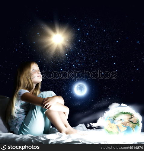 Good night. Girl sitting in bed and dreaming. Elements of this image are furnished by NASA