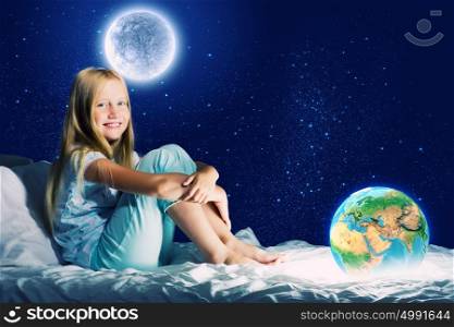Good night. Girl sitting in bed and dreaming. Elements of this image are furnished by NASA
