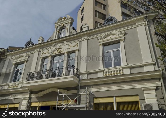 Good renovated ancient building in Ruse - beauty town with varied style West-European architecture, Bulgaria, Europe - balcony with metal fence and stucco ornaments