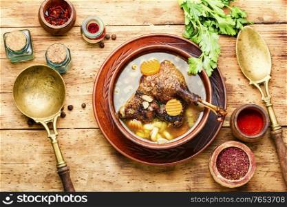 Goose soup with vegetables and pasta. A bowl of duck soup.. Appetizing goose soup