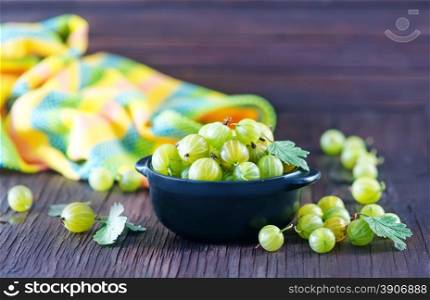gooseberry in bowl and on a table