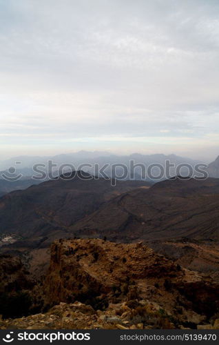 gorge and canyon the deep cloudy sky in oman the old mountain