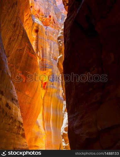 Gorge with rocks of red sandstone in Petra, Jordan. May be used as background