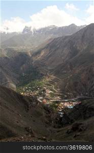 Gorge with village in iranian mountain, Iran