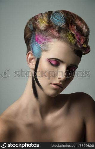 gorgeous colorful beauty portrait of young girl with multicolor painted hair-style and cute make-up