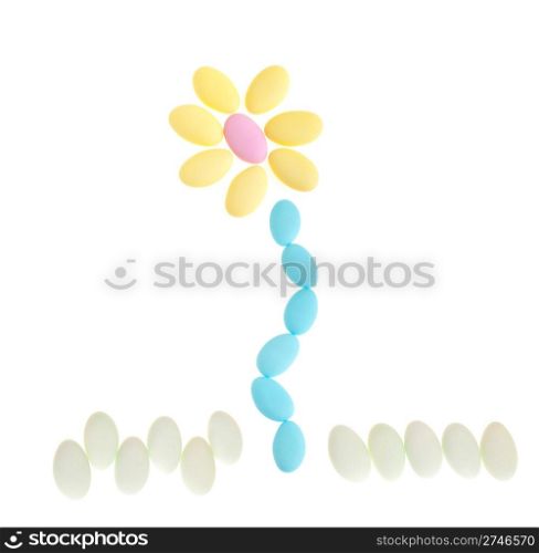 gorgeous flower made with chocolate dragees (isolated on white background)