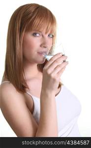 gorgeous ginger woman drinking glass of water