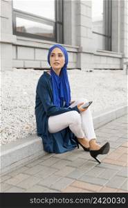gorgeous girl with hijab sitting outside