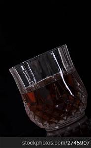 gorgeous glass of whisky on black background