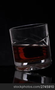 gorgeous glass of whisky on black background