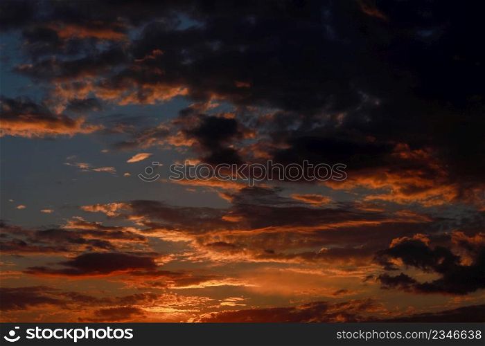 Gorgeous scenic of the sunrise or sunset with dark lining and cloud on the orange sky. Vibrant and Colorful background.. Gorgeous scenic of the sunrise or sunset with dark lining and cloud on the orange sky. Vibrant and Colorful background