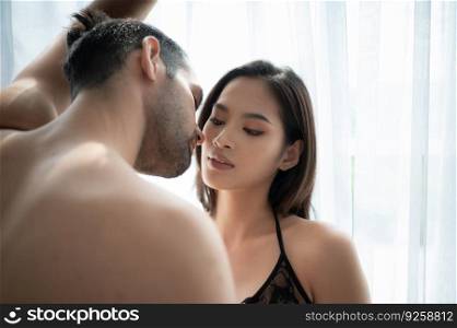 Gorgeous sexy couple enjoying sex in the house’s bedroom, Concept of as emotional relationships passion and love