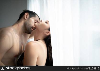 Gorgeous sexy couple enjoying sex in the house’s bedroom, Concept of as emotional relationships passion and love