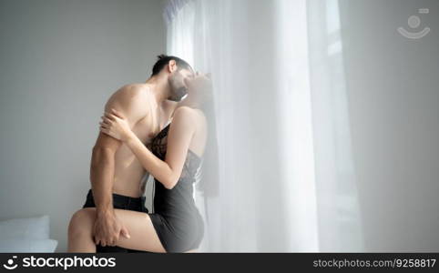 Gorgeous sexy couple enjoying sex in the house’s bedroom, Concept of as emotional relationships passion and love