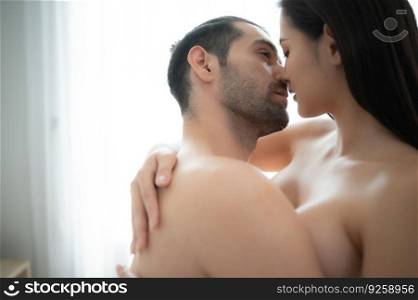 Gorgeous sexy couple enjoying sex on bed in the house’s bedroom, Concept of as emotional relationships passion and love