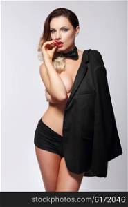 Gorgeous sexy woman in black jacket and tie. Isolated.