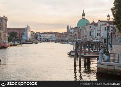 Gorgeous view of the Grand Canal and Basilica Santa Maria della Salute during sunset with clouds, Venice, Italy.. Canal Grande in Venice