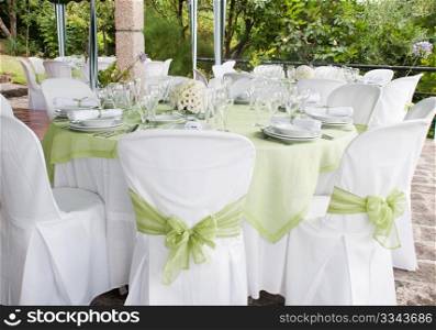 gorgeous wedding chair and table setting for fine dining at outdoors