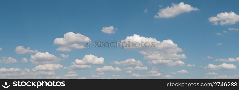 gorgeous white clouds in the blue sky (panoramic picture with copy-space at left top corner)