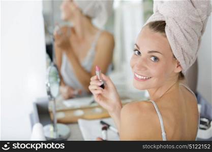 gorgeous woman doing her make-up