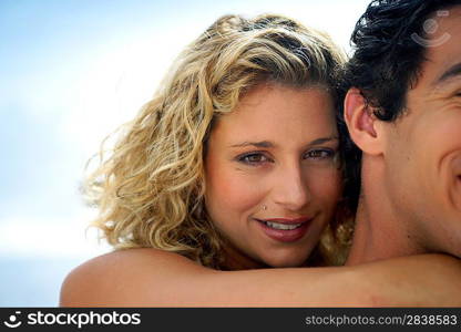 Gorgeous woman embracing her boyfriend