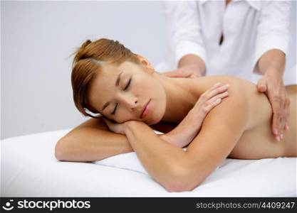Gorgeous woman having a back massage