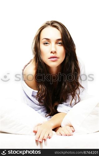 gorgeous woman in bed. gorgeous woman in bed on white background