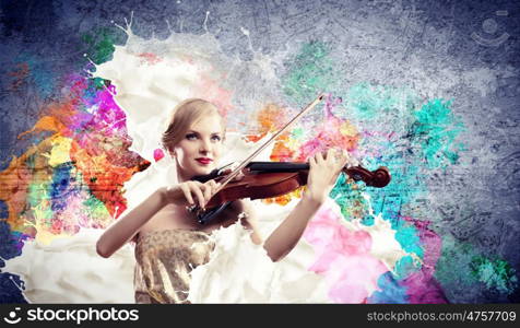 Gorgeous woman playing on violin. Image of beautiful female violinist playing with against colorful background