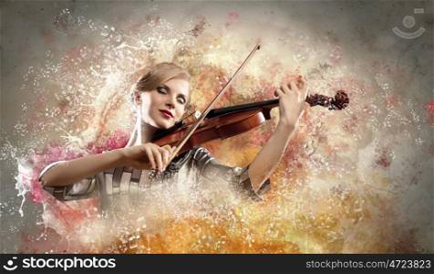 Gorgeous woman playing violin. Image of gorgeous woman playing violin against colorful background