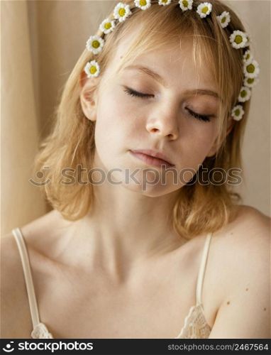 gorgeous woman posing while wearing spring flowers crown