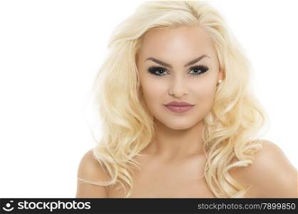 Gorgeous young blond woman with dark eye makeup and long curly hair posing with bare shoulders facing the camera with a smile, isolated on white