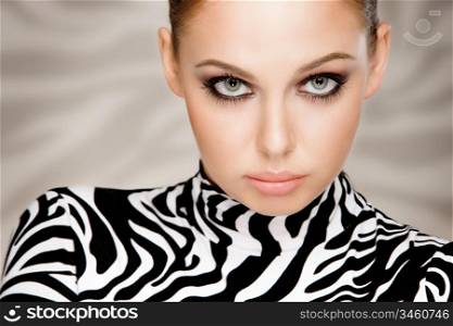 gorgeous young woman posing in zebra pattern outfit