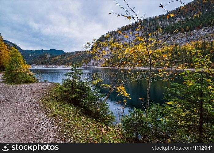 Gosauseen or Vorderer Gosausee lake, Upper Austria. Colorful autumn alpine view of mountain lake with clear transparent water and reflections.