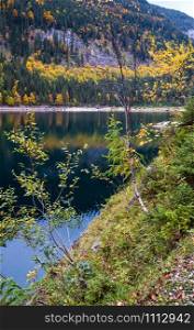 Gosauseen or Vorderer Gosausee lake, Upper Austria. Colorful autumn alpine view of mountain lake with clear transparent water and reflections.