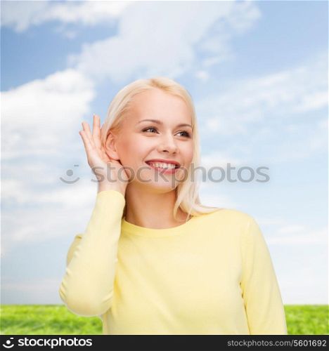 gossip, communication and people concept - smiling young woman listening to gossip