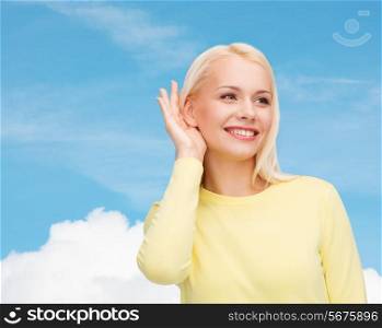 gossip, communication and people concept - smiling young woman listening to gossip