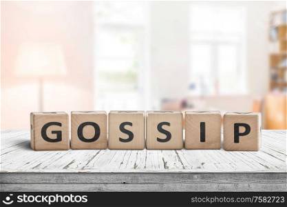 Gossip text sign in a bright living room on a white painted wooden desk