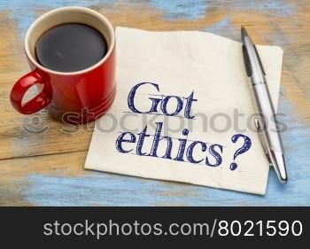 Got ethics? Are you ethical question. Handwriting on a napkin with cup of coffee.