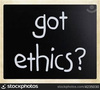 ""Got ethics" handwritten with white chalk on a blackboard."