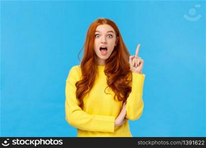 Got idea, listen. Excited creative redhead girl inspired, have plan or suggestion, raise index finger eureka gesture and speaking her solution, standing blue background enthusiastic.. Got idea, listen. Excited creative redhead girl inspired, have plan or suggestion, raise index finger eureka gesture and speaking her solution, standing blue background enthusiastic