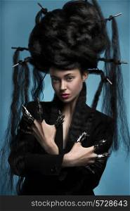 Gothic style shot of a woman with claw rings