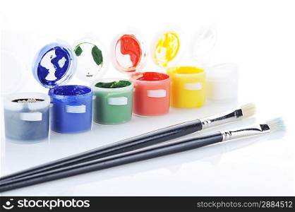 Gouache paint cans and brush isolated on white background